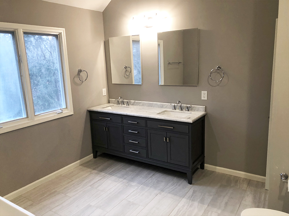 A2Z Contractors completed a full bathroom remodel bringing this bathroom from dark and dated to modern, bright, and functional.